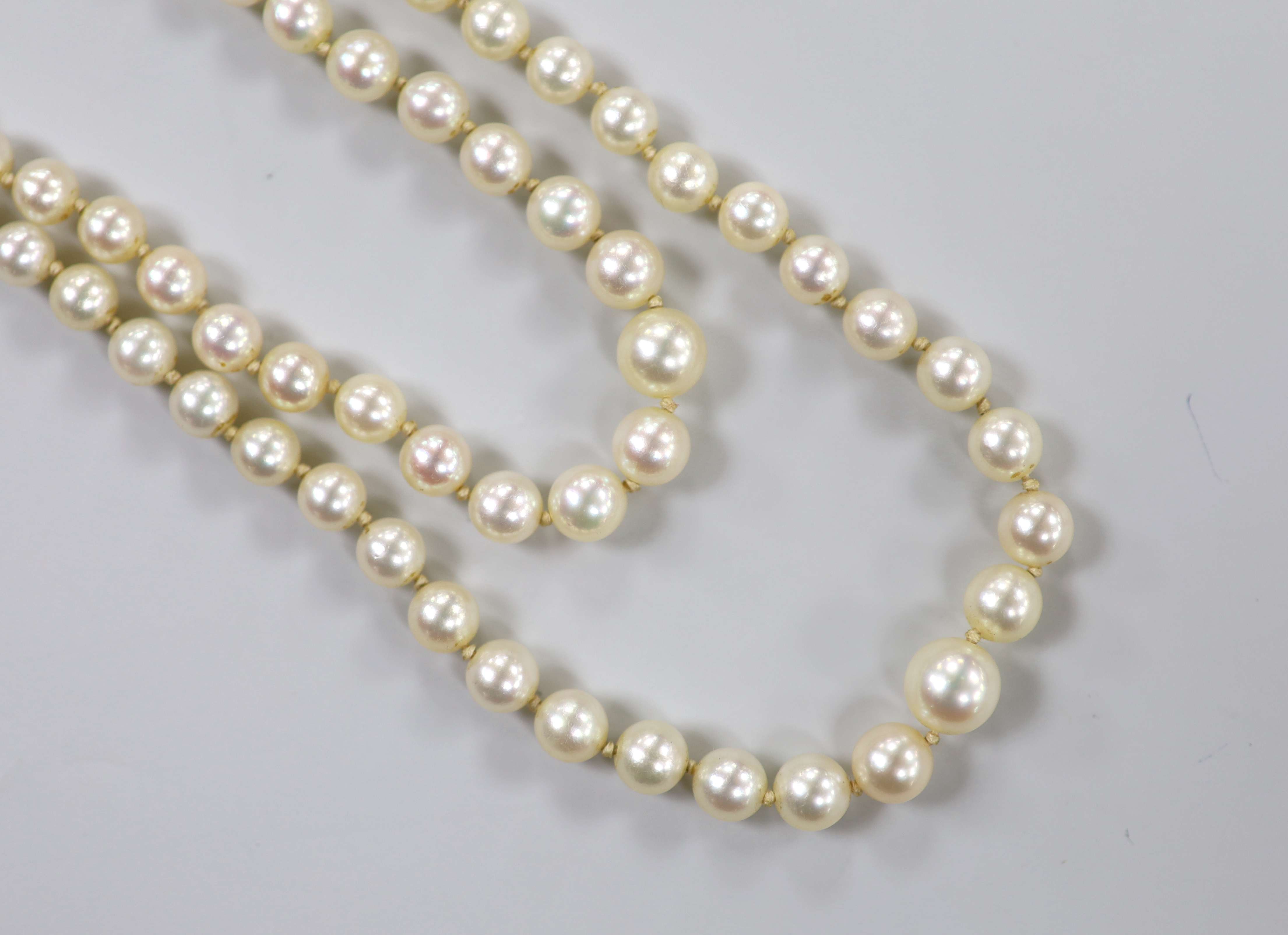 A Mikimoto double strand graduated cultured pearl necklace, with cultured pearl set white metal clasp, 48cm